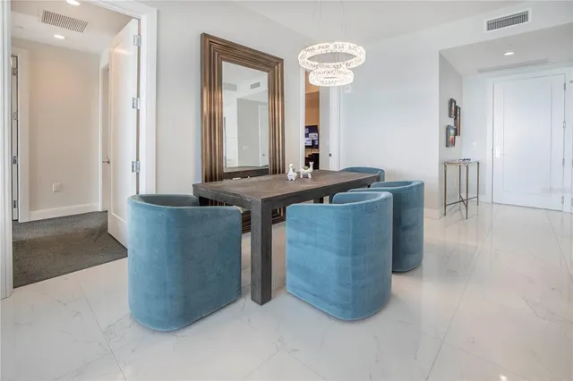 a kitchen with stainless steel appliances granite countertop a sink and a refrigerator