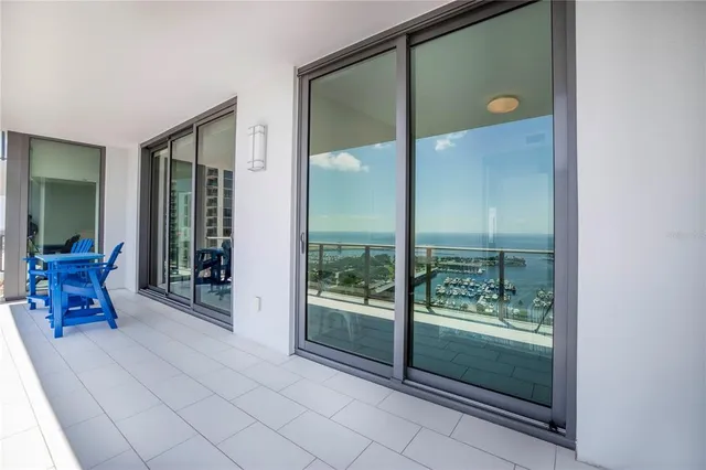 a bedroom with a bed and a chair