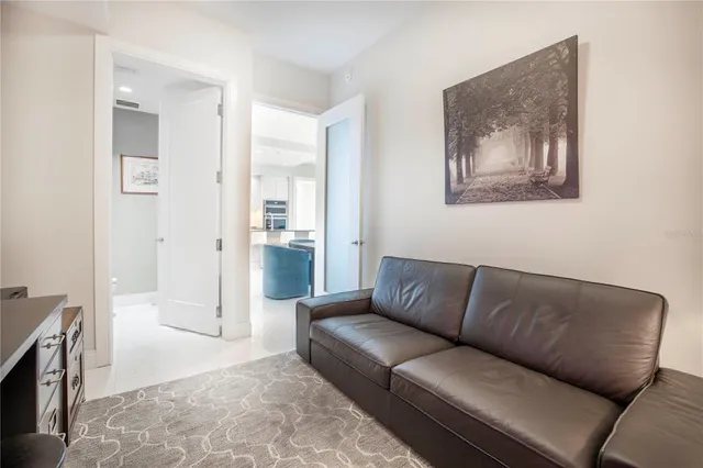 a bedroom with a bed and a lamp