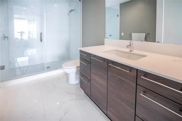 a bedroom with a bed and a mirror