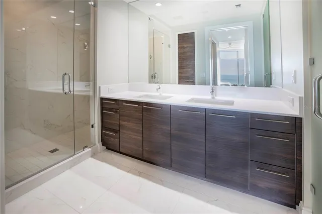 a bedroom with a bed and lamp