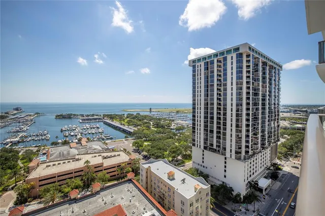 a view of a patio with dining table and chairs