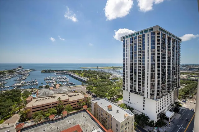 a swimming pool with outdoor seating and yard