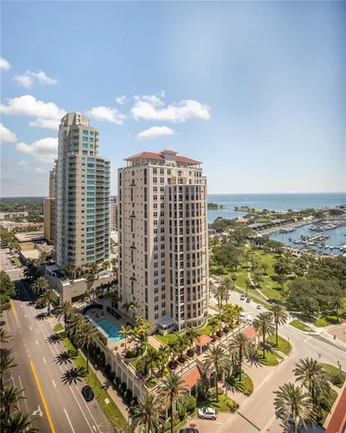 a view of a swimming pool with outdoor seating
