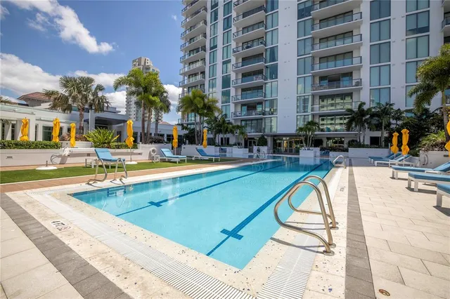 a view of a patio with couches and potted plants