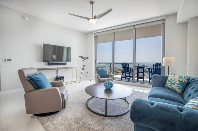 a living room with furniture and a lamp