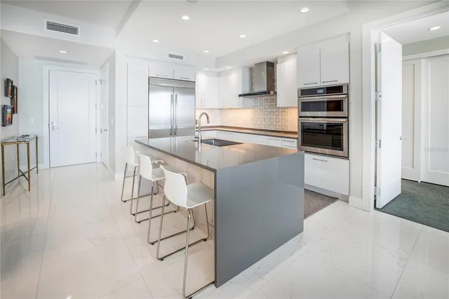a view of an entryway with wooden floor and wall