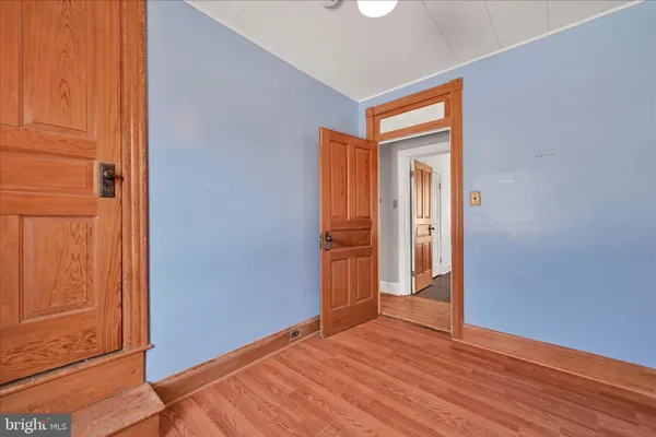 a bathroom with a granite countertop sink toilet a mirror and shower