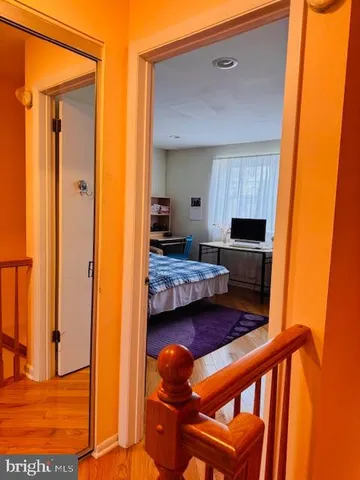 a bedroom with a bed and a table