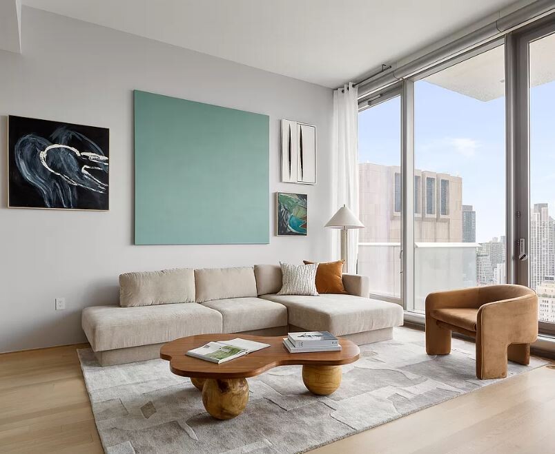 56 Leonard Street, Unit 43BEAST Manhattan, NY 10013 - Photo 2 of 16 a living room with furniture and a large window