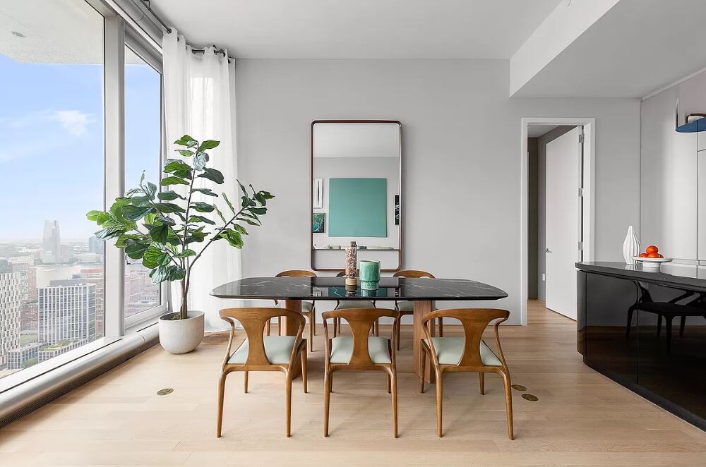56 Leonard Street, Unit 43BEAST Manhattan, NY 10013 - Photo 3 of 16 a view of a dining room with furniture window and wooden floor