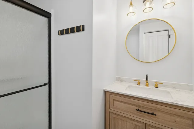 a bathroom with a sink and a mirror