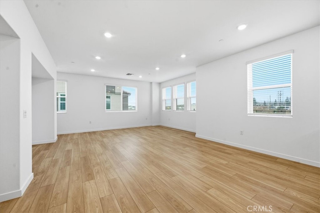 9335 Via Azul Pico Rivera, CA 90660 - Photo 19 of 55 a view of an empty room with wooden floor and a window