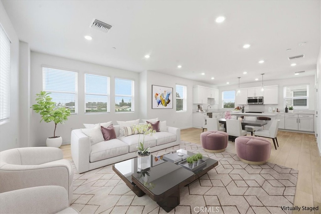 9335 Via Azul Pico Rivera, CA 90660 - Photo 22 of 55 a living room with furniture potted plant and kitchen view
