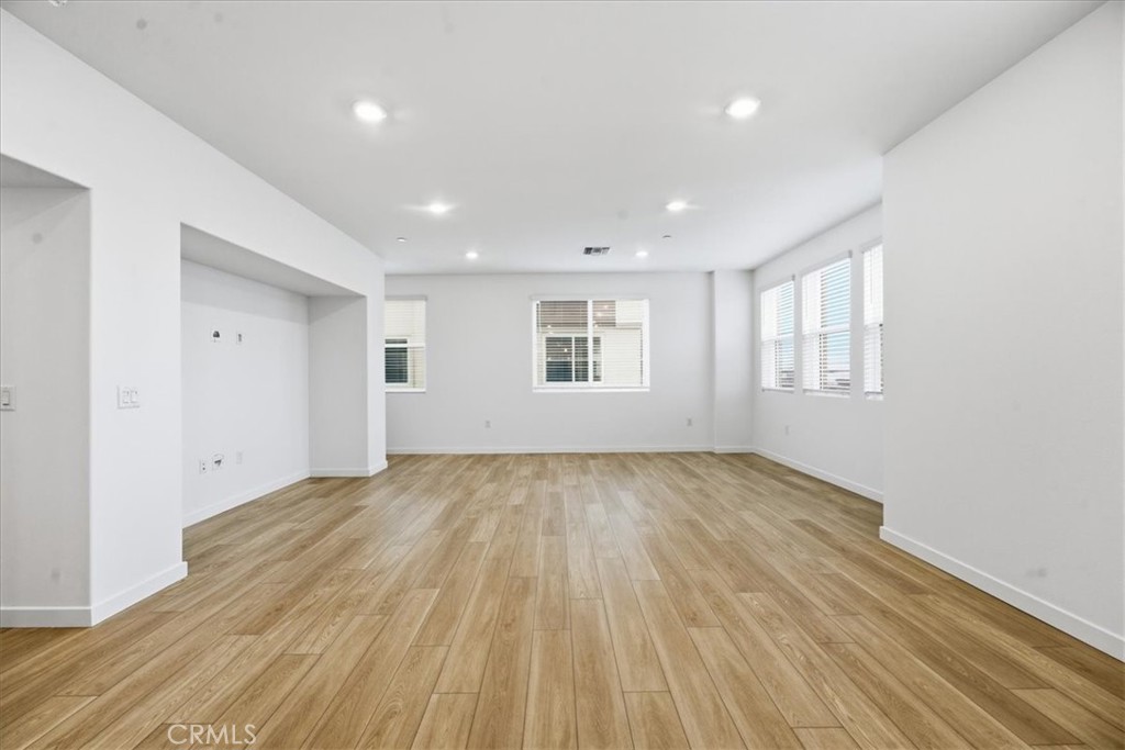 9335 Via Azul Pico Rivera, CA 90660 - Photo 27 of 55 a view of an empty room with wooden floor and a window