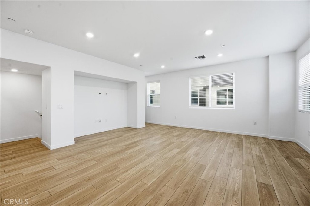 9335 Via Azul Pico Rivera, CA 90660 - Photo 29 of 55 a view of empty room with wooden floor and fan