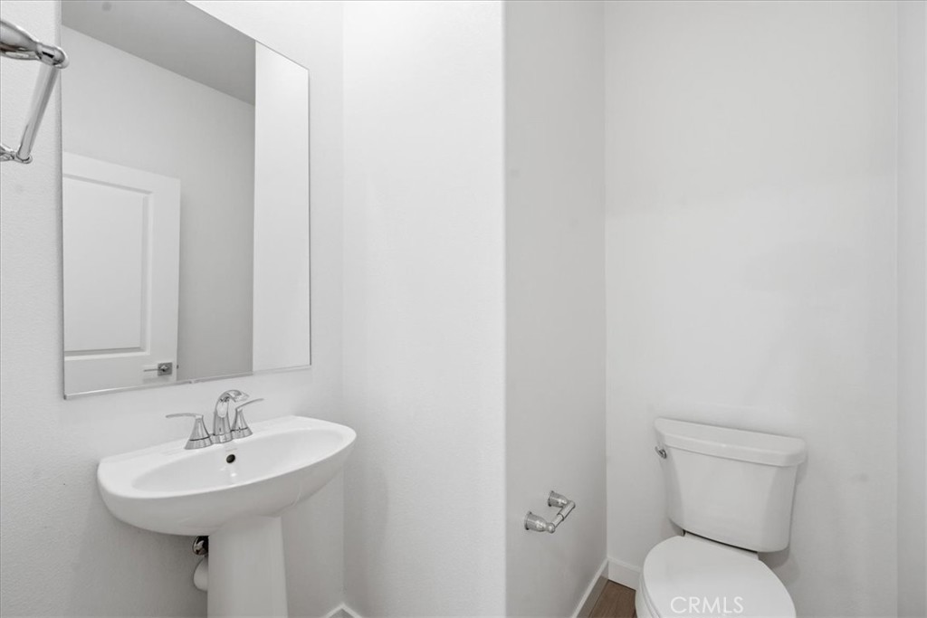 9335 Via Azul Pico Rivera, CA 90660 - Photo 31 of 55 a bathroom with a sink mirror and toilet