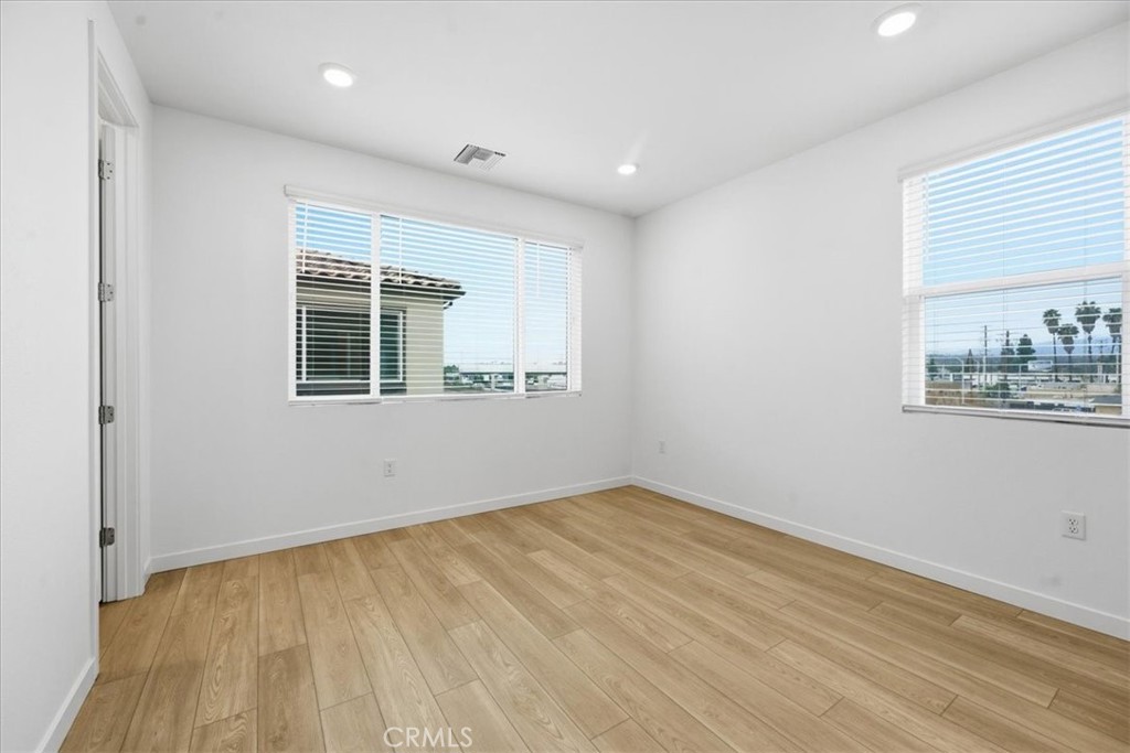 9335 Via Azul Pico Rivera, CA 90660 - Photo 34 of 55 a view of empty room with wooden floor and fan