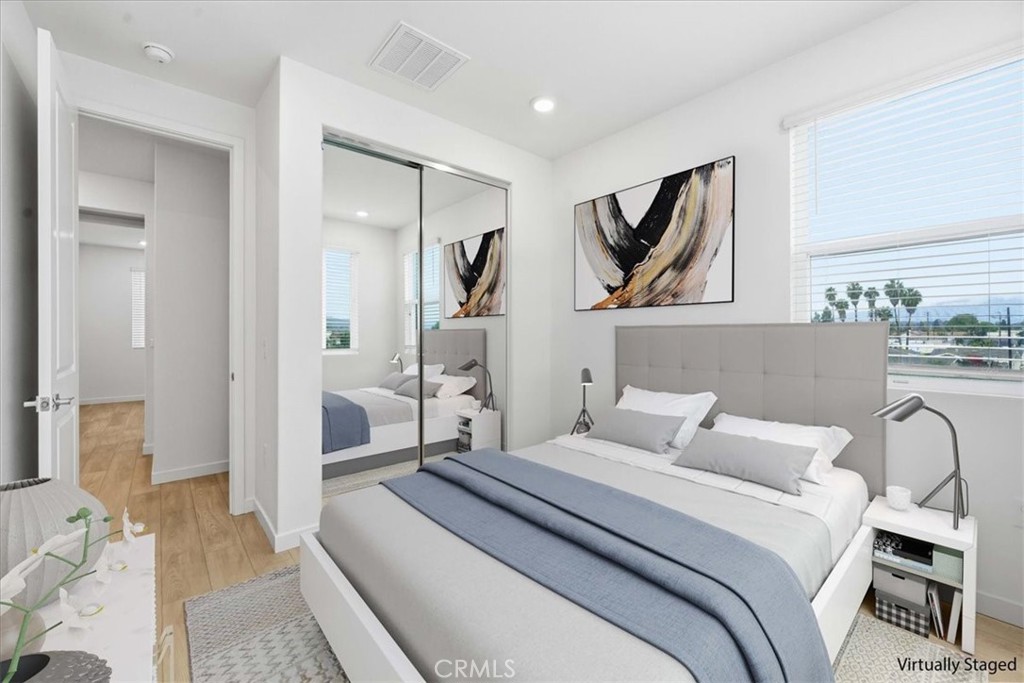 9335 Via Azul Pico Rivera, CA 90660 - Photo 45 of 55 a bedroom with a bed and a painting on the wall