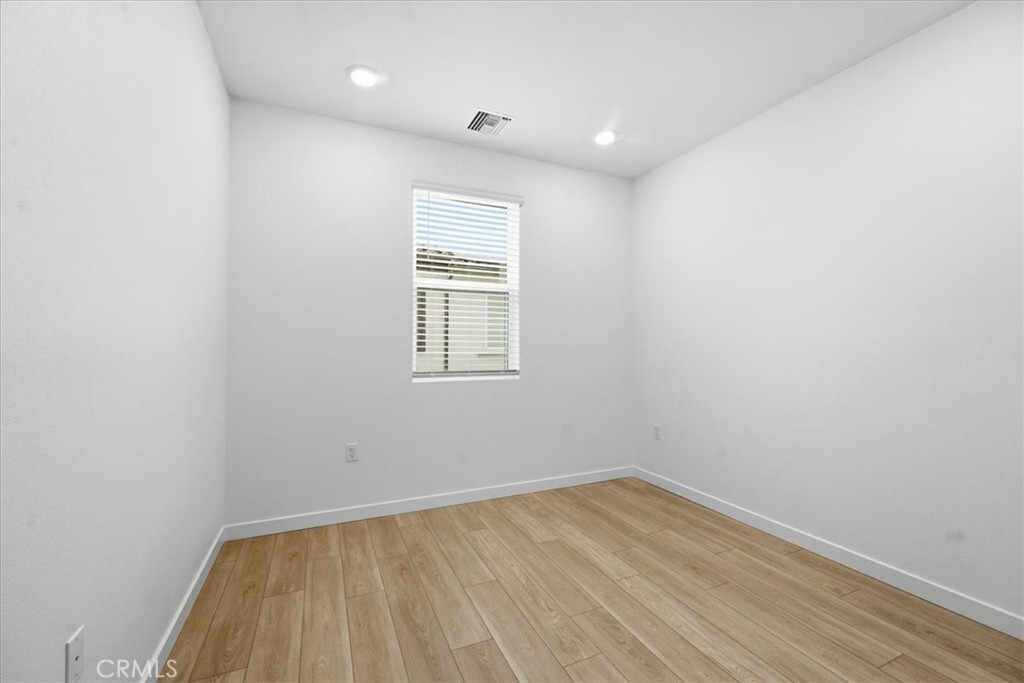 9335 Via Azul Pico Rivera, CA 90660 - Photo 46 of 55 an empty room with a hardwood and a window