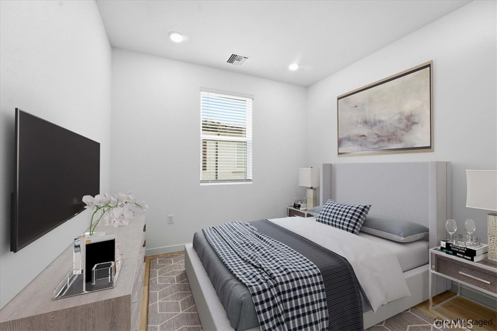 9335 Via Azul Pico Rivera, CA 90660 - Photo 47 of 55 a bedroom with a bed and a flat screen tv