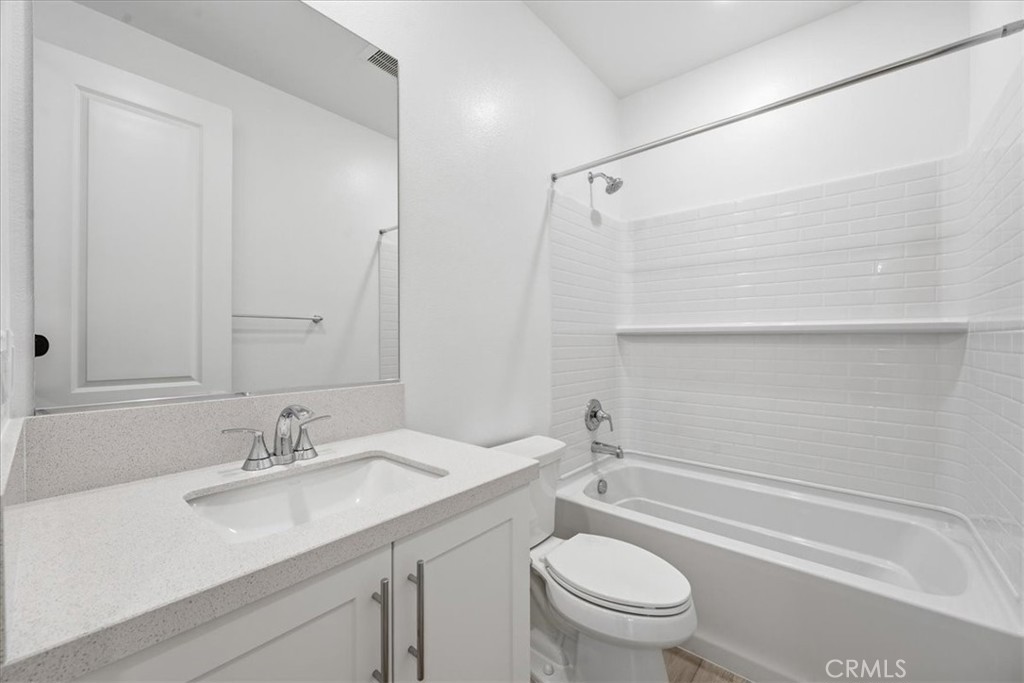 9335 Via Azul Pico Rivera, CA 90660 - Photo 50 of 55 a bathroom with a sink a toilet and a bathtub