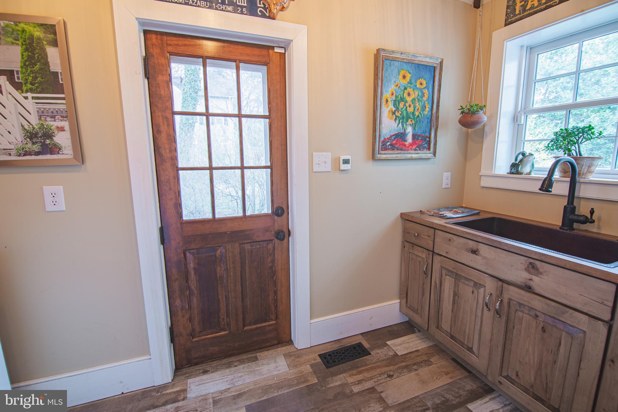 613 South Valley Forge Road Wayne, PA 19087 - Photo 14 of 43 a view of a hallway and a livingroom with wooden floor and window