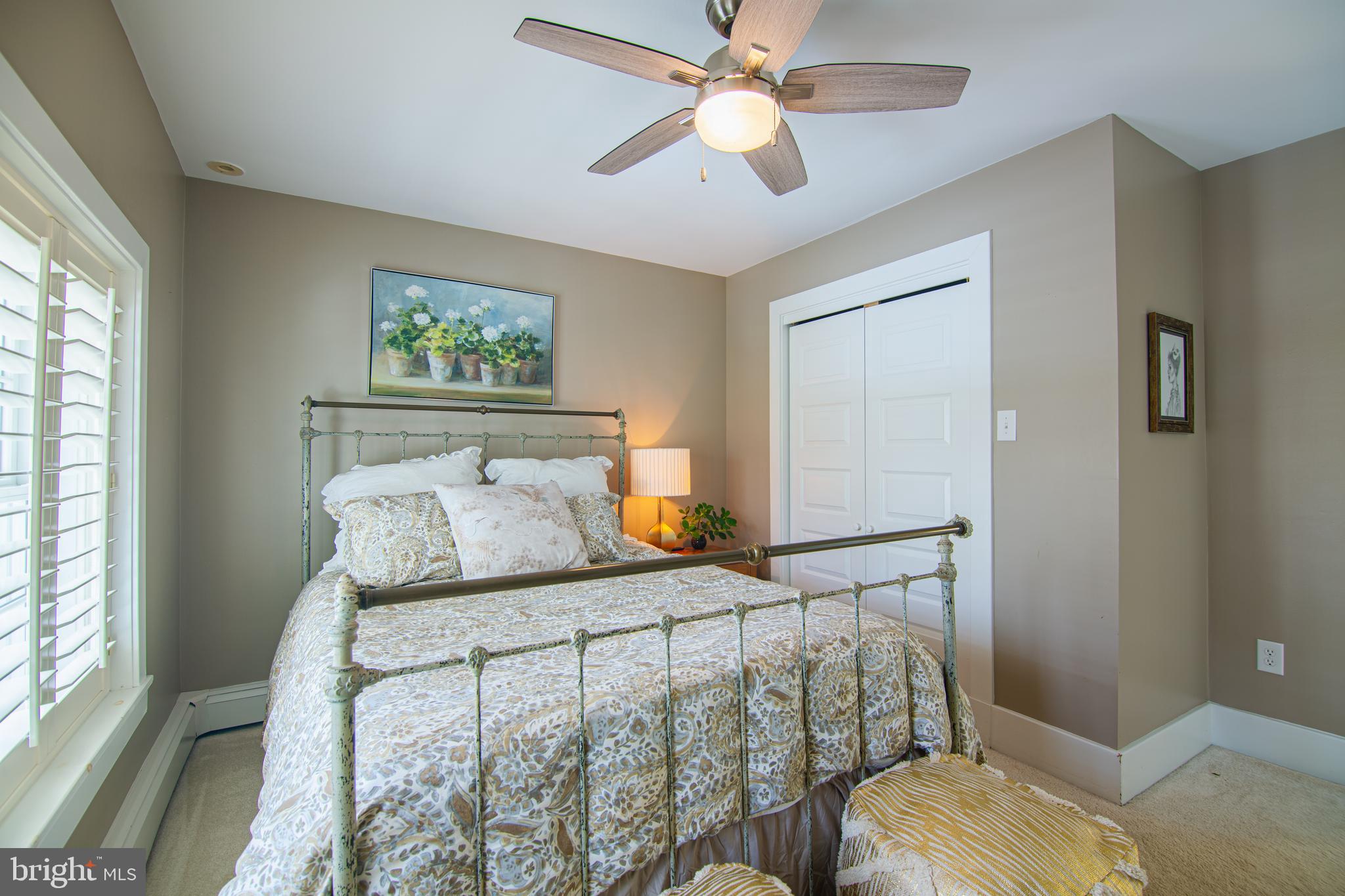 613 South Valley Forge Road Wayne, PA 19087 - Photo 21 of 43 a bedroom with a bed and a chandelier
