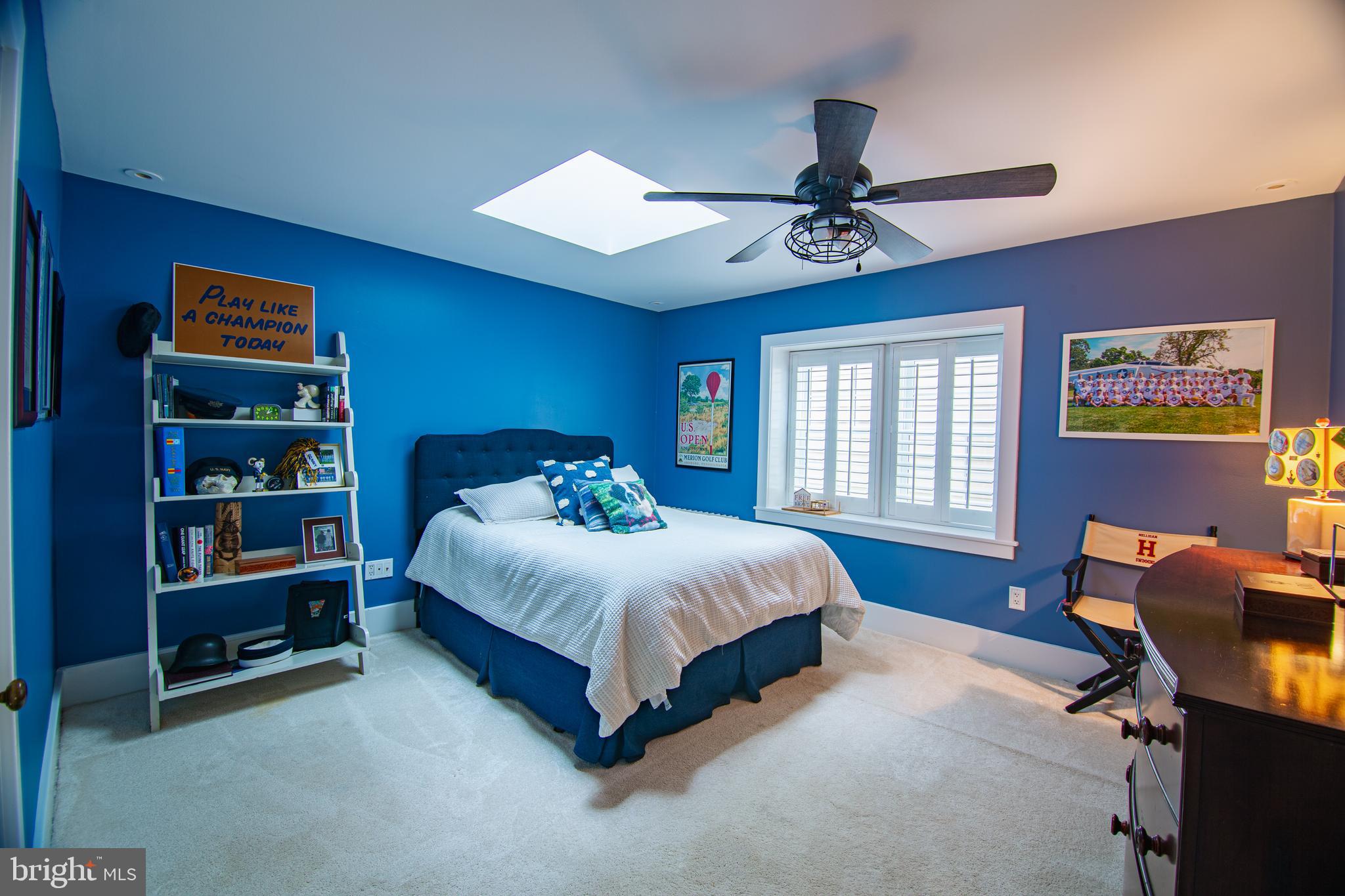 613 South Valley Forge Road Wayne, PA 19087 - Photo 23 of 43 a spacious bedroom with a bed and a chandelier