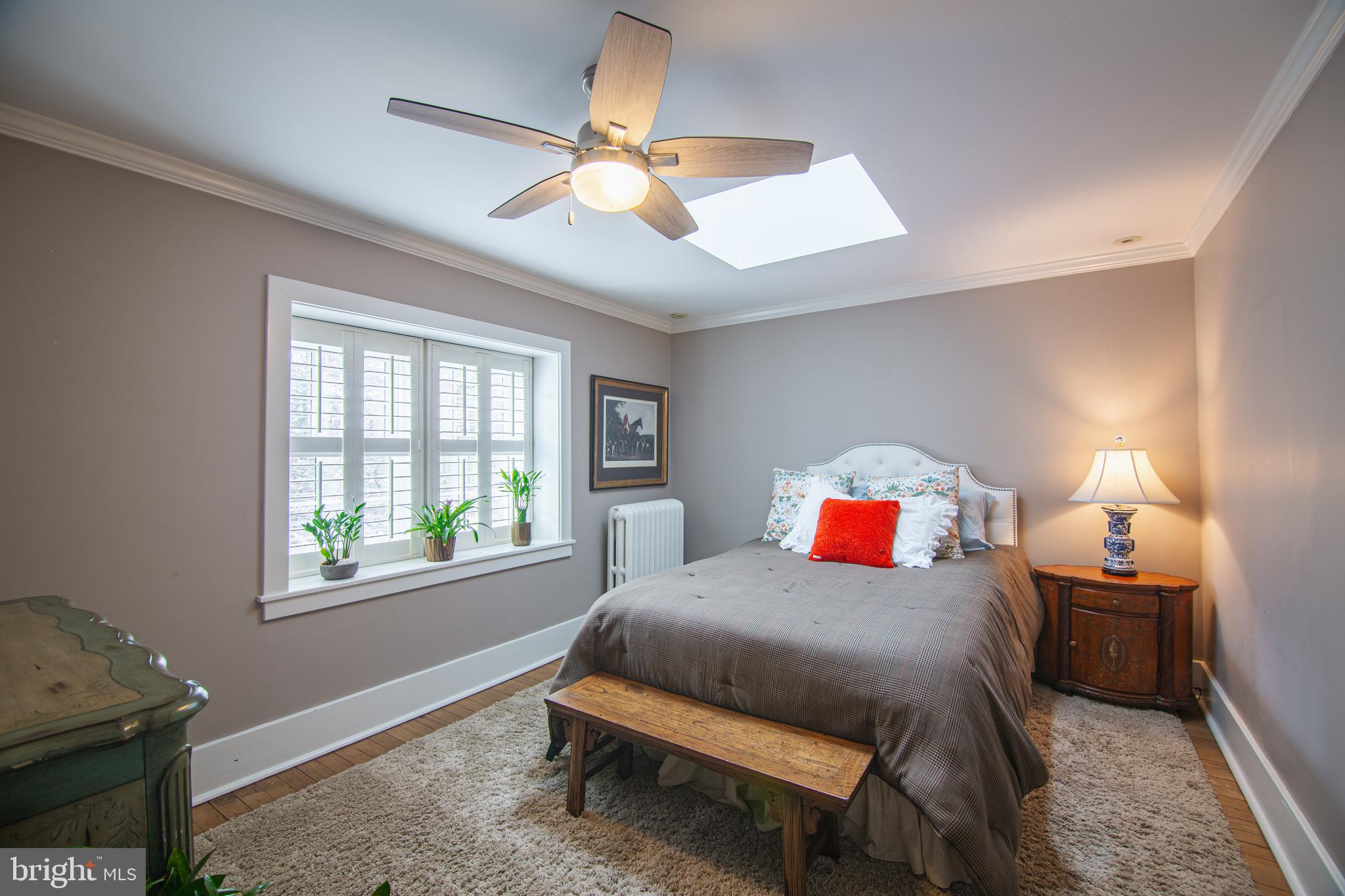 613 South Valley Forge Road Wayne, PA 19087 - Photo 26 of 43 a bedroom with a bed and a chandelier