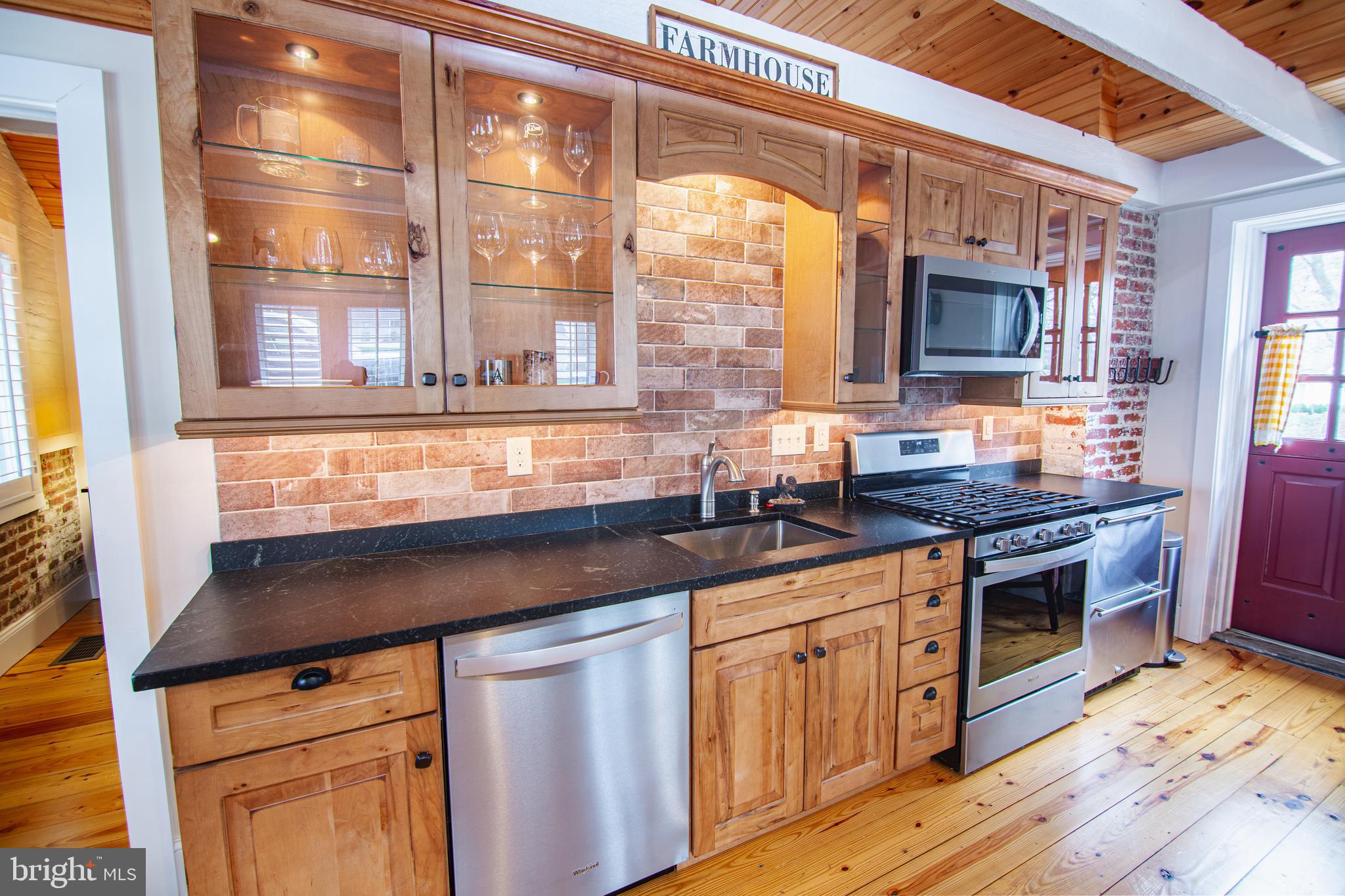 613 South Valley Forge Road Wayne, PA 19087 - Photo 31 of 43 a kitchen with stainless steel appliances granite countertop a stove and a sink