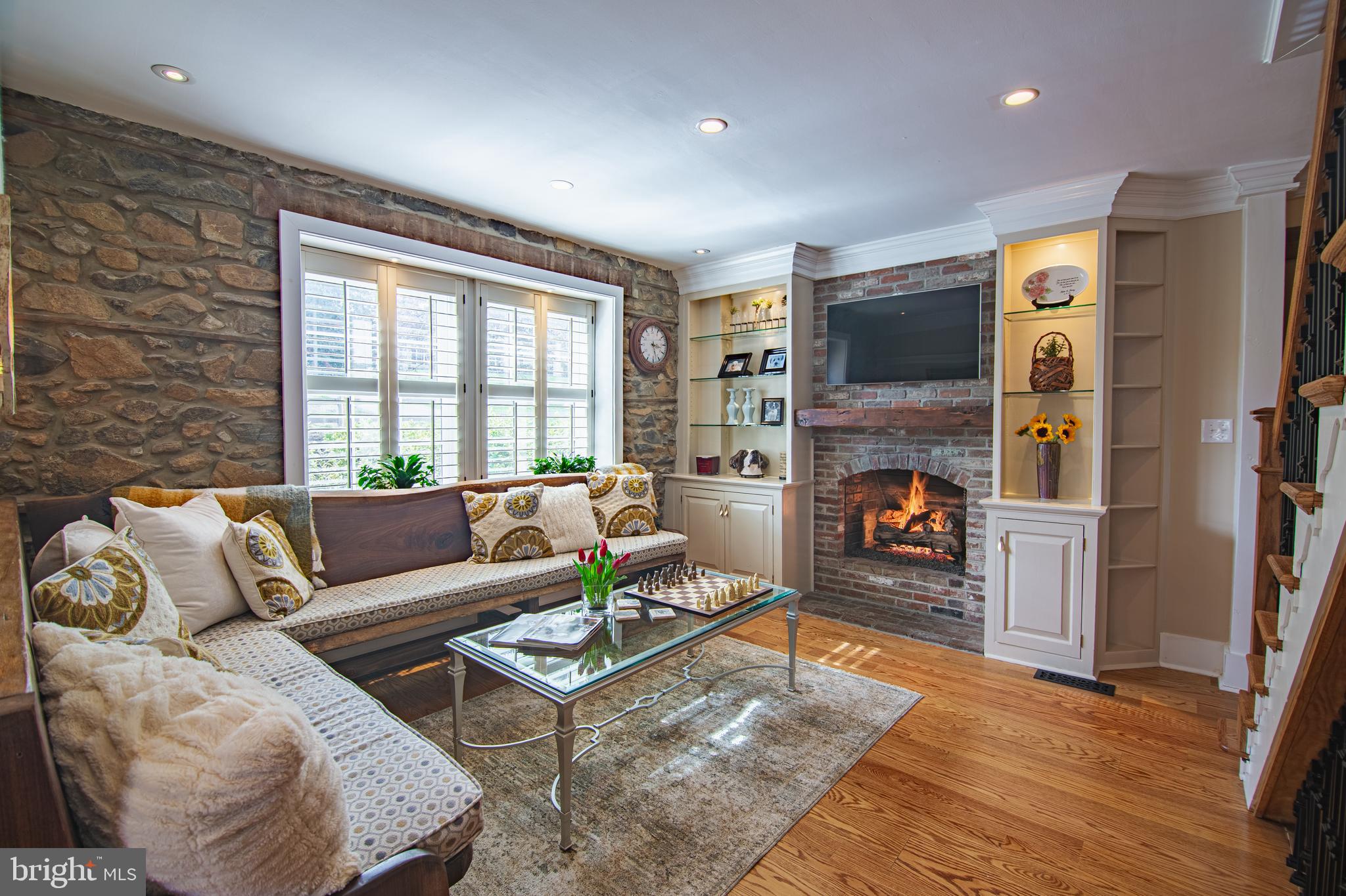 613 South Valley Forge Road Wayne, PA 19087 - Photo 9 of 43 a living room with furniture and a fireplace