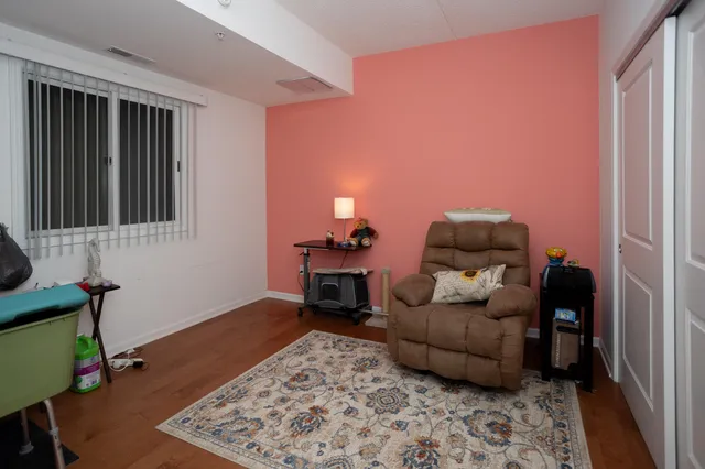 a bathroom with a shower a toilet and a sink