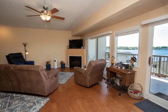 a living room with furniture fireplace and flat screen tv