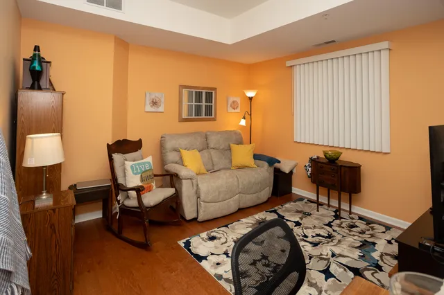 a living room with a couch and a flat screen tv