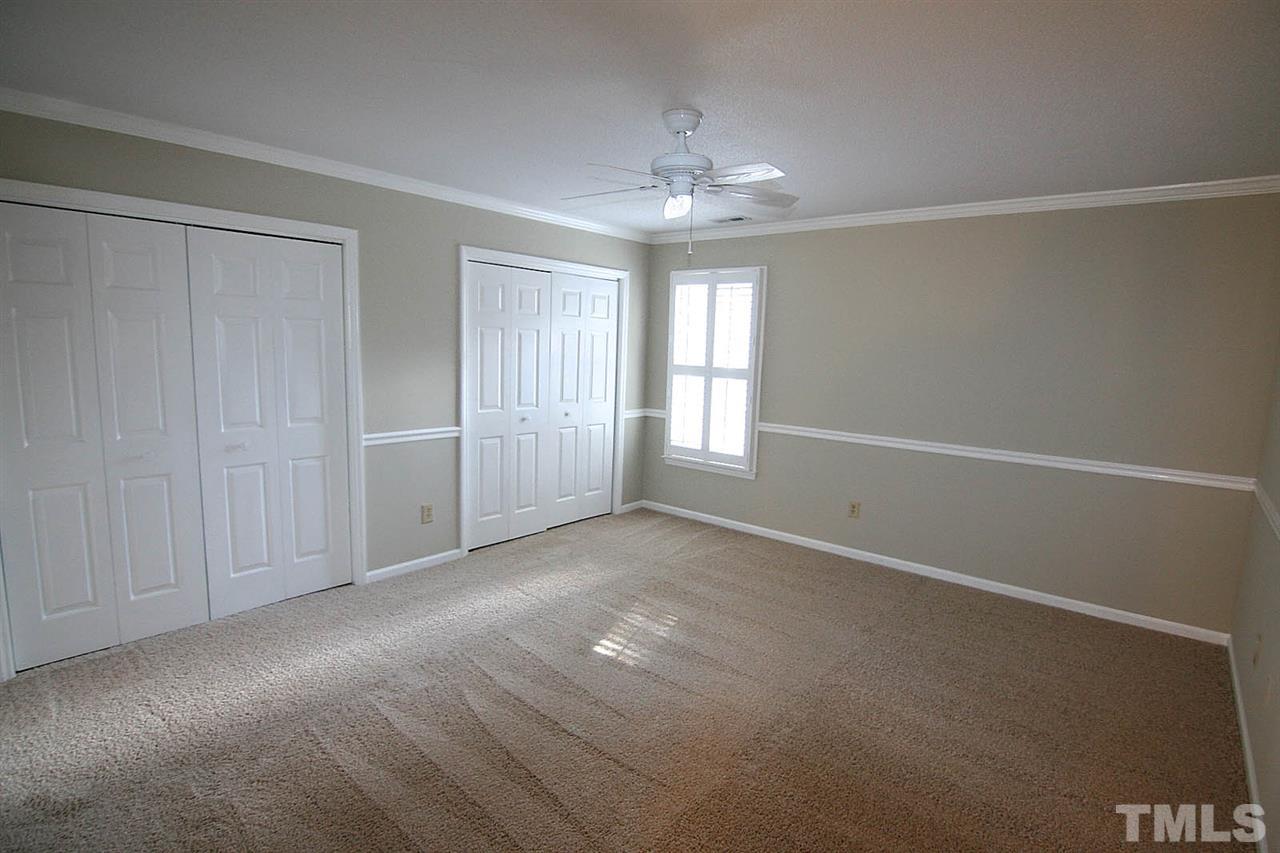 1581 Laureldale Drive Raleigh, NC 27609 - Photo 11 of 21 a view of an empty room with chandelier and window