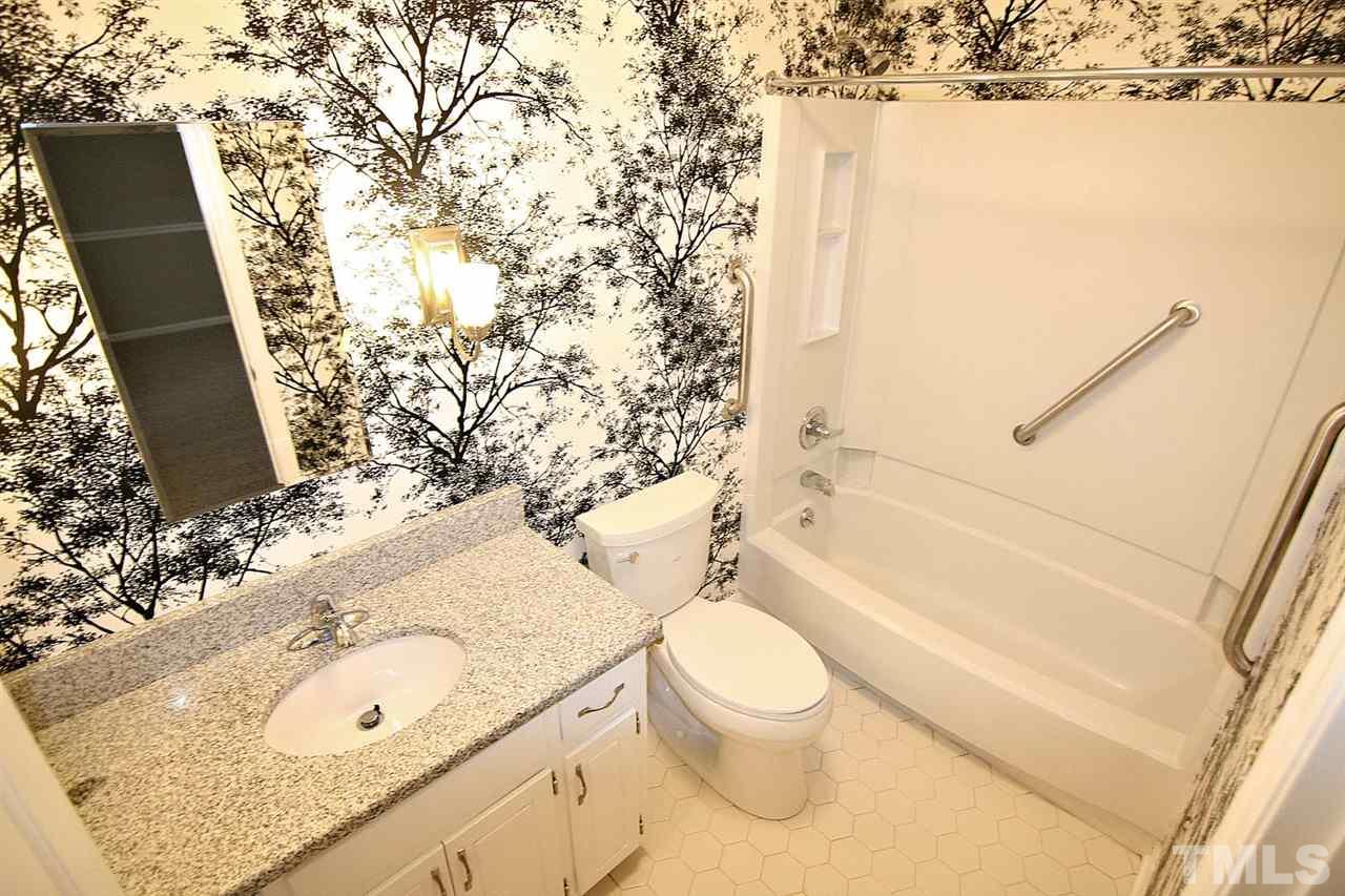 1581 Laureldale Drive Raleigh, NC 27609 - Photo 13 of 21 a bathroom with a granite countertop sink toilet and shower