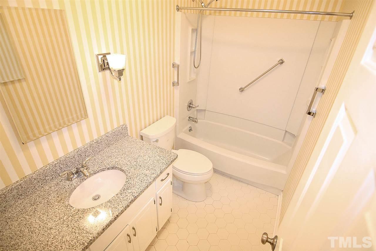 1581 Laureldale Drive Raleigh, NC 27609 - Photo 15 of 21 a bathroom with a granite countertop sink toilet and shower