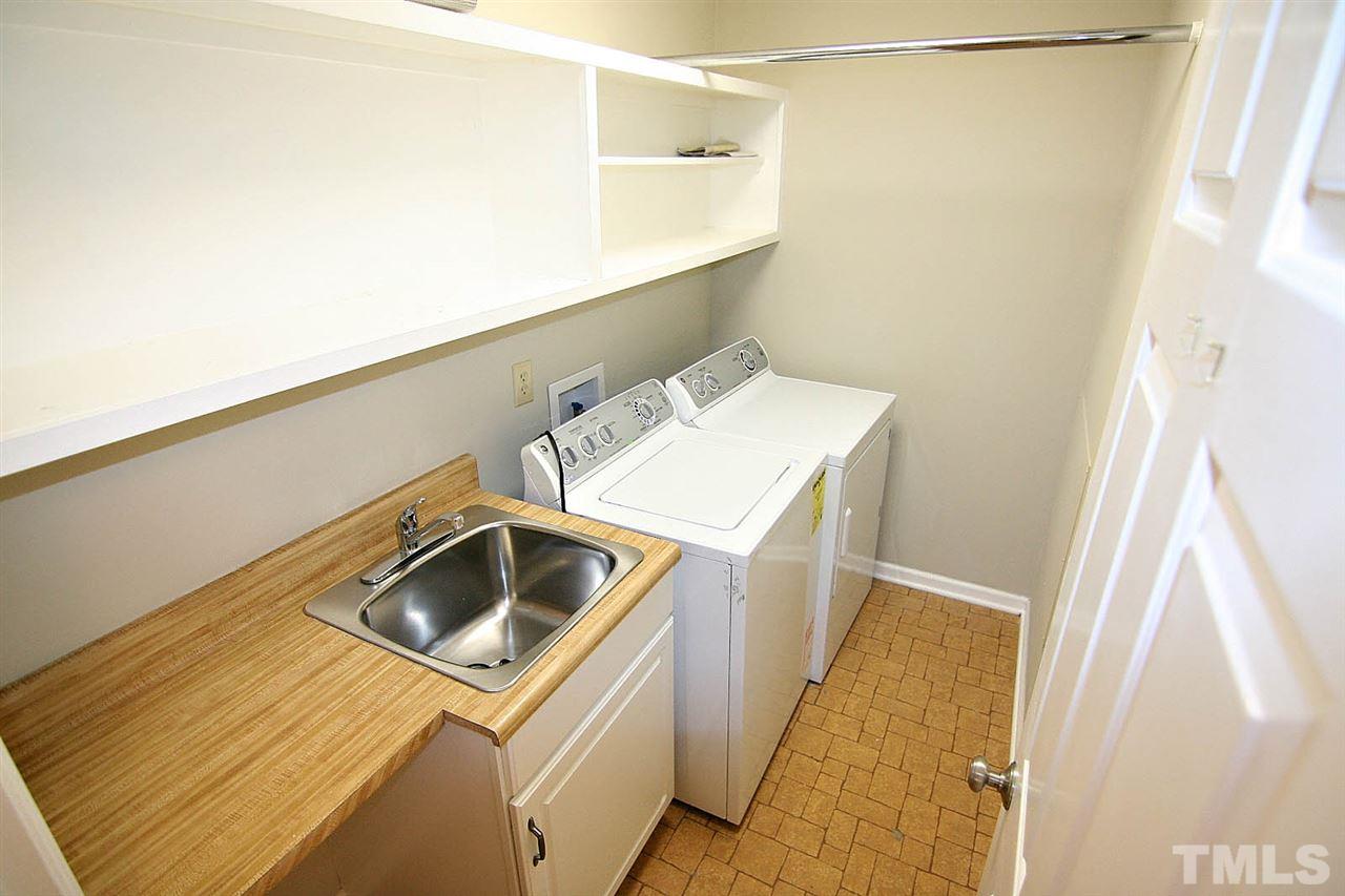 1581 Laureldale Drive Raleigh, NC 27609 - Photo 16 of 21 a utility room with dryer and washer