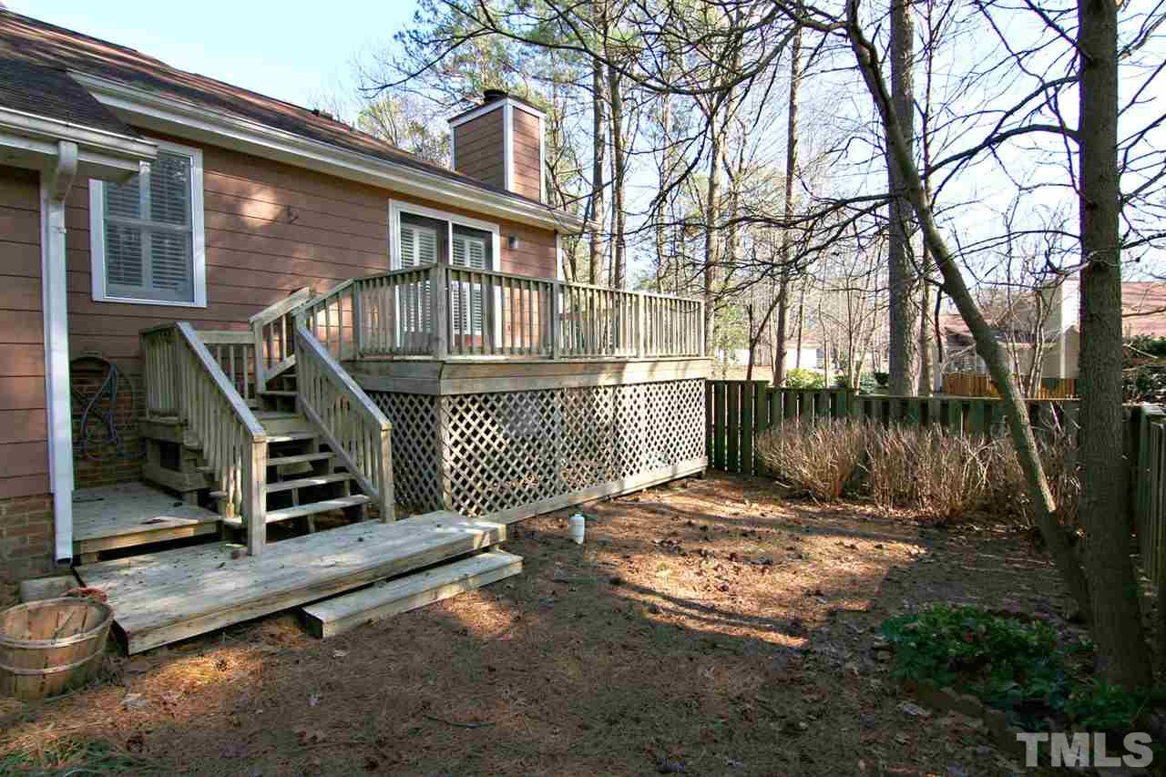 1581 Laureldale Drive Raleigh, NC 27609 - Photo 3 of 21 a view of a house with a wooden fence next to a house