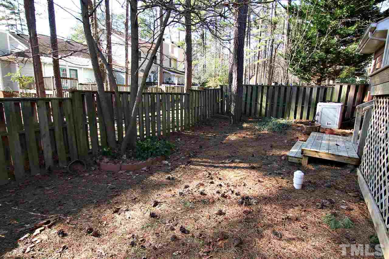 1581 Laureldale Drive Raleigh, NC 27609 - Photo 21 of 21 a view of a park with large trees and wooden fence