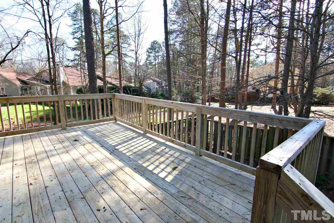 1581 Laureldale Drive Raleigh, NC 27609 - Photo 4 of 21 a view of balcony with wooden floor and fence