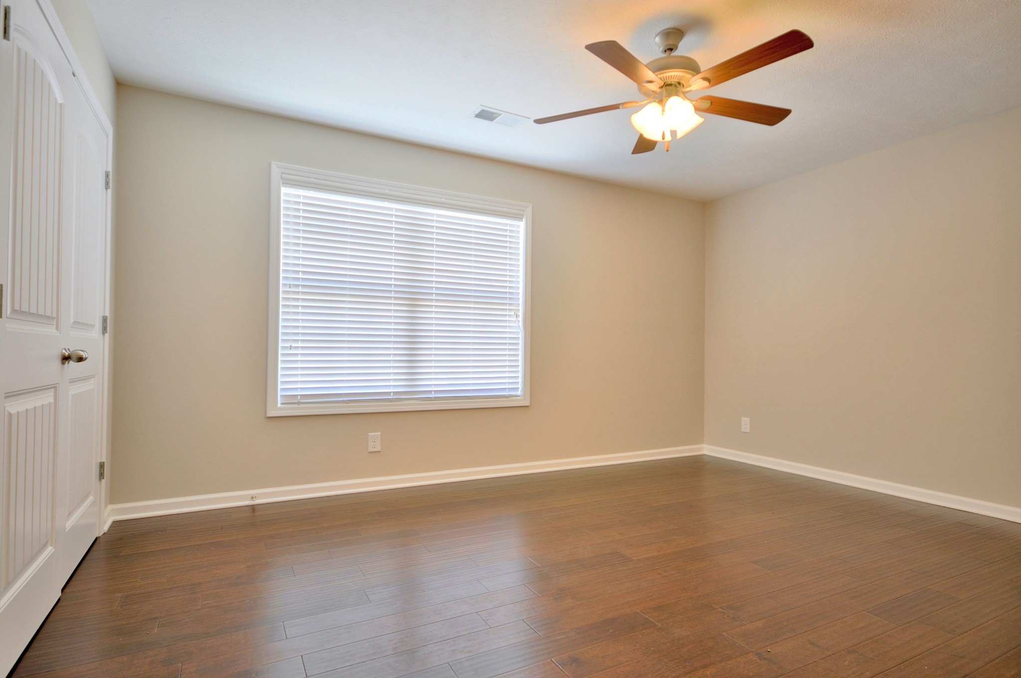 117 Melbourne Drive, Unit E Clarksville, TN 37043 - Photo 11 of 17 an empty room with a window and a fan