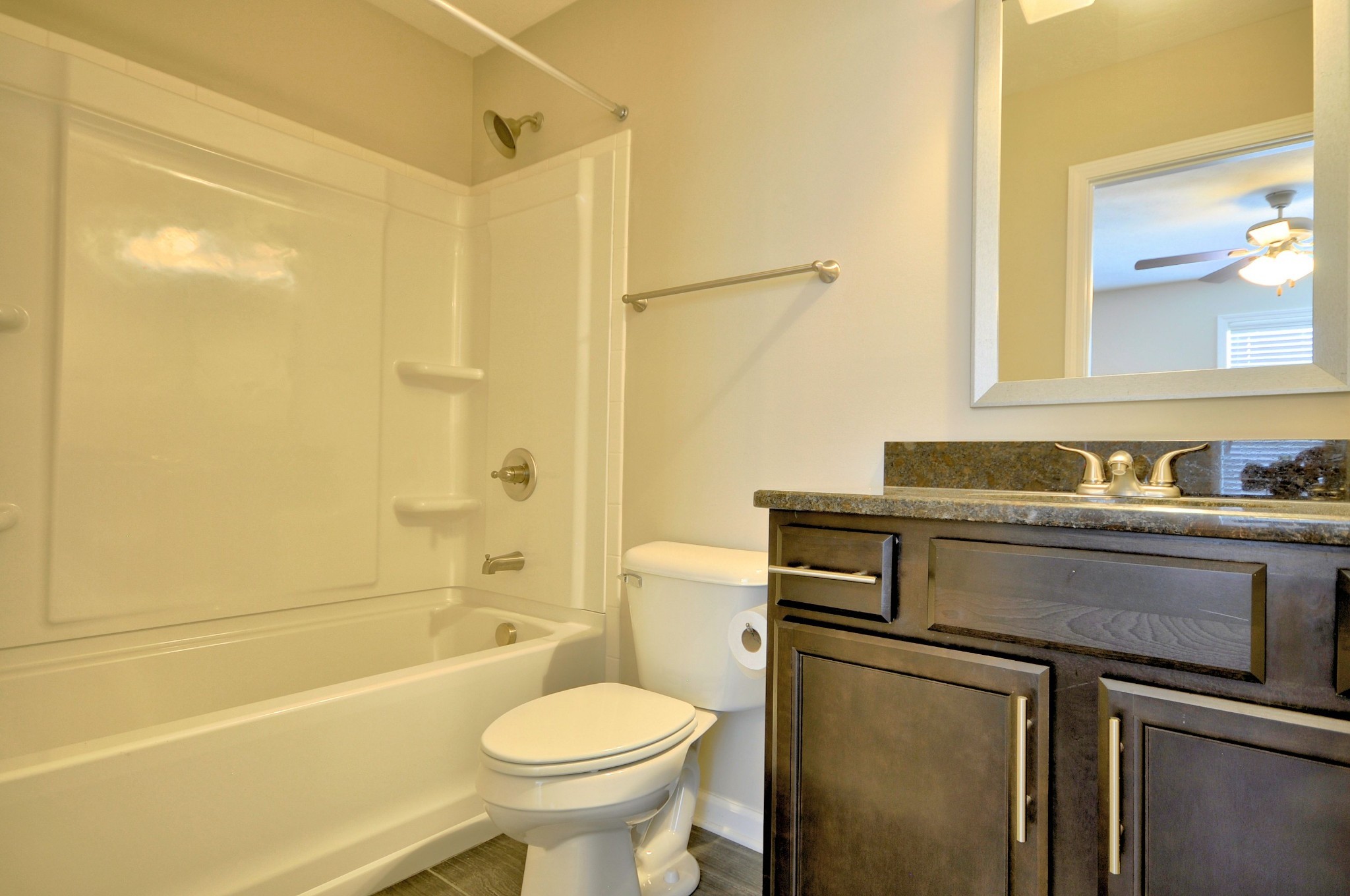 117 Melbourne Drive, Unit E Clarksville, TN 37043 - Photo 12 of 17 a bathroom with a sink a toilet and shower