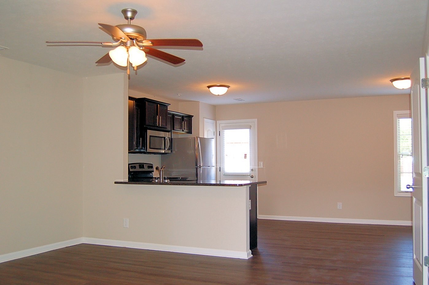 117 Melbourne Drive, Unit E Clarksville, TN 37043 - Photo 2 of 17 a view of a kitchen with a sink a cabinet and wooden floor