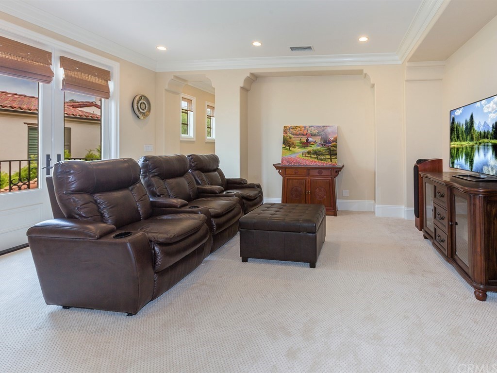 26 Tideline Bluff Newport Coast, CA 92657 - Photo 20 of 31 a living room with furniture and a flat screen tv