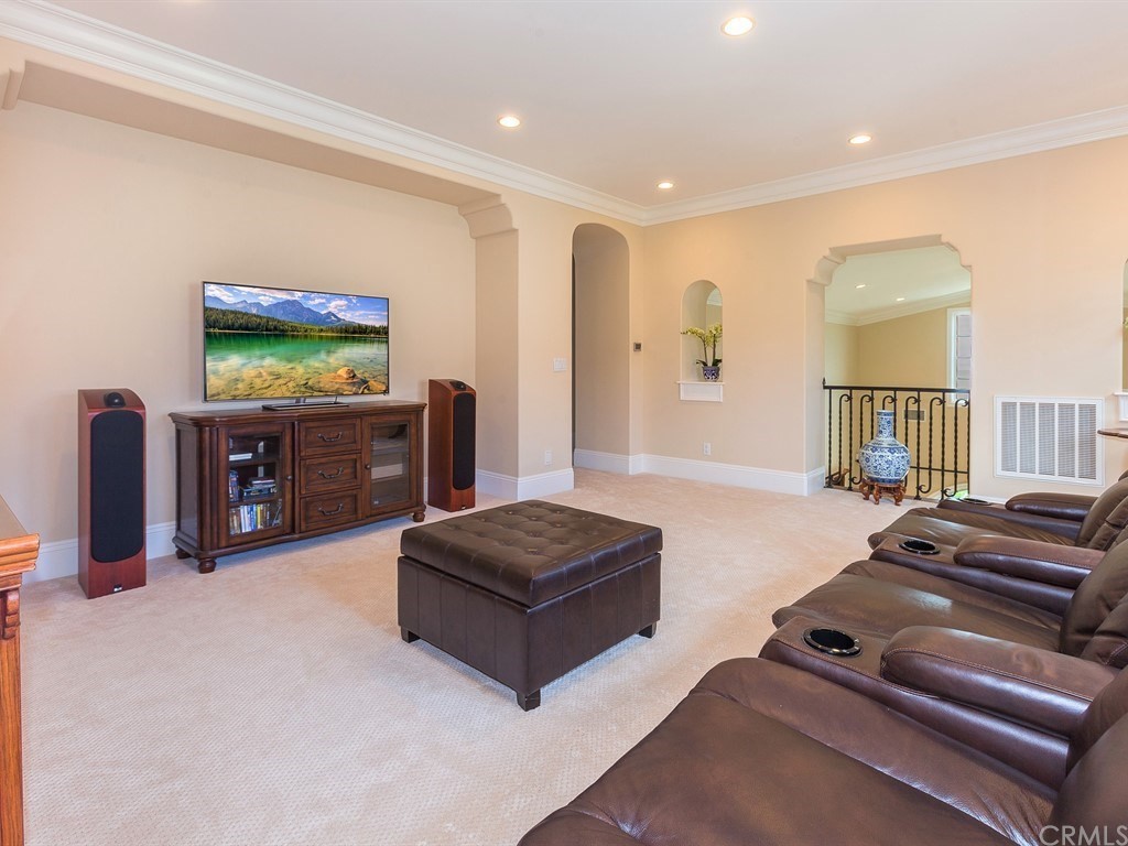 26 Tideline Bluff Newport Coast, CA 92657 - Photo 21 of 31 a living room with furniture and a flat screen tv