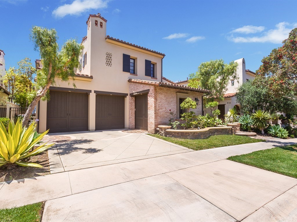 26 Tideline Bluff Newport Coast, CA 92657 - Photo 5 of 31 a front view of a house with a yard and potted plants