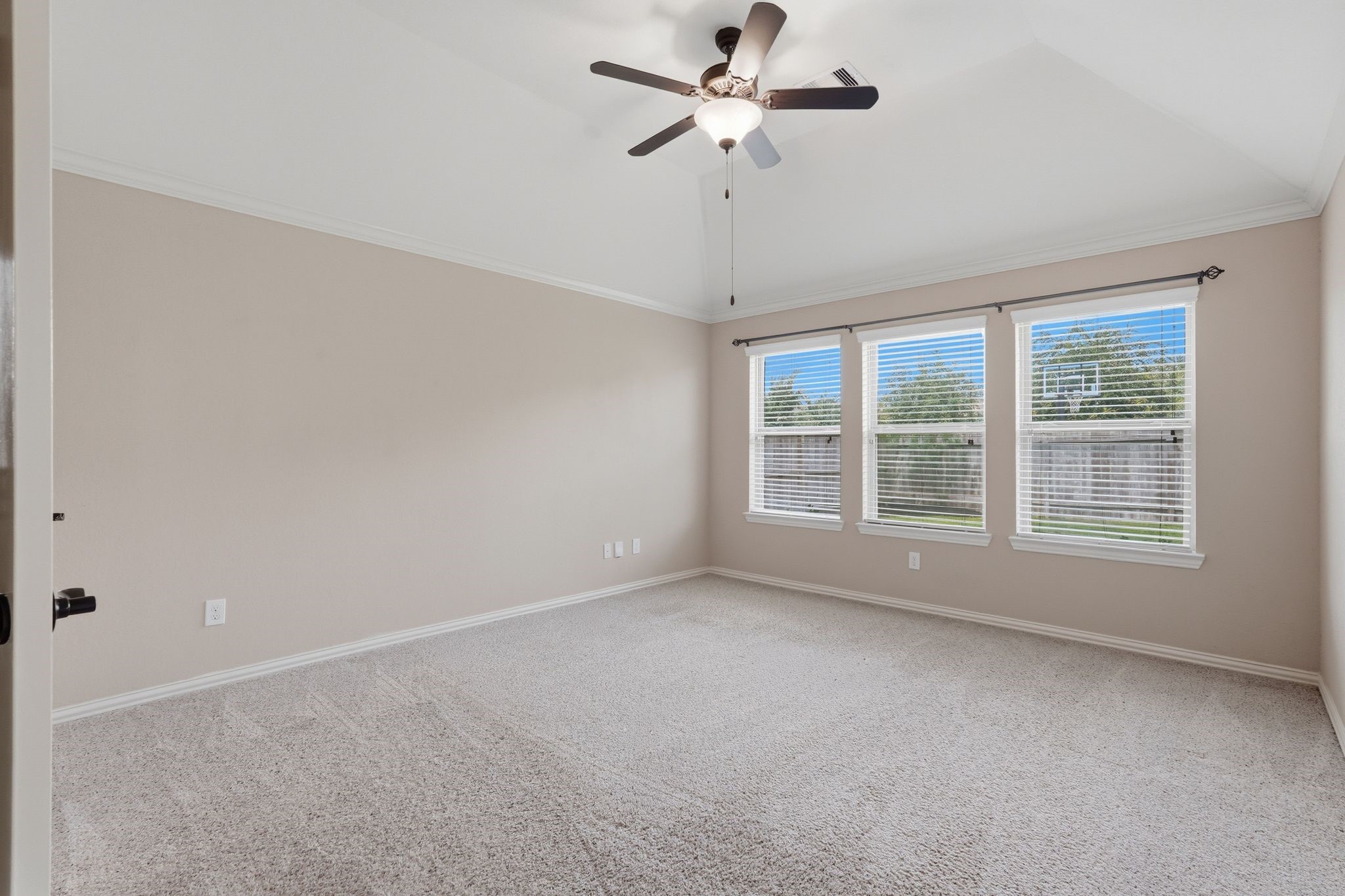 18227 Tacoma Ridge Drive Tomball, TX 77377 - Photo 20 of 45 Generous primary retreat featuring vaulted ceilings and abundant natural light.