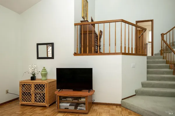 a view of an entryway with wooden floor
